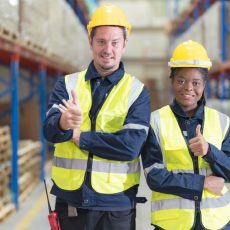 A young woman and man working in a warehouse, organizing and managing inventory